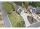 Aerial shot showcasing the home's well-maintained lawn, long driveway, and beautiful landscaping at 4950 Willow Creek Dr, Woodstock, GA 30188