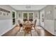 Bright breakfast nook with a wooden table, four chairs, and lots of natural light at 4950 Willow Creek Dr, Woodstock, GA 30188