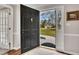 Inviting entryway with a view of the front yard, showcasing natural light and a welcoming atmosphere at 4950 Willow Creek Dr, Woodstock, GA 30188