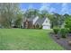 Two-story home with a well-maintained lawn and a two-car garage, offering ample space and classic charm at 4950 Willow Creek Dr, Woodstock, GA 30188