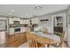 Bright kitchen next to breakfast nook with stainless steel appliances and white cabinetry at 4950 Willow Creek Dr, Woodstock, GA 30188