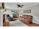 Living room featuring hardwood floors, fireplace, and a comfortable seating arrangement at 4950 Willow Creek Dr, Woodstock, GA 30188