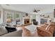 Spacious living room with hardwood floors, fireplace, and a comfortable seating arrangement at 4950 Willow Creek Dr, Woodstock, GA 30188