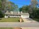 Charming single-story home featuring a welcoming front porch and a two-car garage, set on a lush green lawn at 105 Whisper Way, Dacula, GA 30019