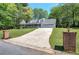 Charming home with a manicured lawn, covered porch, and turret-style gazebo at 105 Whisper Way, Dacula, GA 30019