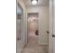 This interior hallway features neutral walls, carpet flooring, and doors leading to other rooms at 105 Whisper Way, Dacula, GA 30019