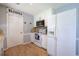 Kitchen area featuring white appliances, butcher block countertops, and light gray paint at 105 Whisper Way, Dacula, GA 30019