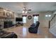 Spacious living room featuring a stone fireplace and hardwood floors at 105 Whisper Way, Dacula, GA 30019