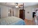 Main bedroom showcasing the four poster bed, hardwood floors, and access to ensuite bathroom at 105 Whisper Way, Dacula, GA 30019