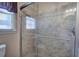 This bathroom features a glass-enclosed shower with decorative tile and a built-in shower niche at 105 Whisper Way, Dacula, GA 30019