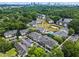 Apartment community featuring mature trees, ample parking, swimming pool, and sand volleyball court at 1150 Collier Nw Rd # A7, Atlanta, GA 30318