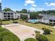 Beautiful apartment complex featuring a sand volleyball court and outdoor pool with well-maintained landscaping at 1150 Collier Nw Rd # A7, Atlanta, GA 30318