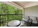 Relaxing balcony with outdoor seating and lush green views for unwinding and enjoying nature at 1150 Collier Nw Rd # A7, Atlanta, GA 30318