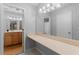 Bathroom with wood cabinets, large vanity countertop, and well-lit mirror at 1150 Collier Nw Rd # A7, Atlanta, GA 30318