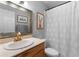 Bathroom with decorative mirror, framed art, and shower curtain at 1150 Collier Nw Rd # A7, Atlanta, GA 30318