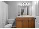 Bathroom showcasing vanity, commode, framed mirror, and tub with shower at 1150 Collier Nw Rd # A7, Atlanta, GA 30318