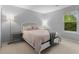 Serene bedroom with natural light, neutral tones, carpet, and comfortable furnishings for restful sleep at 1150 Collier Nw Rd # A7, Atlanta, GA 30318