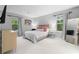 Bedroom features a plush bed, large windows, and modern furniture at 1150 Collier Nw Rd # A7, Atlanta, GA 30318