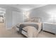 Neutral bedroom featuring a comfortable bed, white furniture, and closet for ample storage at 1150 Collier Nw Rd # A7, Atlanta, GA 30318