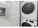 Convenient laundry area featuring stacked washer and dryer units, optimizing space and efficiency at 1150 Collier Nw Rd # A7, Atlanta, GA 30318