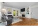 Inviting living room with hardwood floors, fireplace, built-ins, and balcony access, ideal for relaxation at 1150 Collier Nw Rd # A7, Atlanta, GA 30318