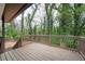 Inviting back deck offers a serene space surrounded by lush greenery and mature trees at 2190 Highview Rd, Atlanta, GA 30311