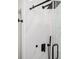 Close up on shower with black hardware and marble tile walls at 2190 Highview Rd, Atlanta, GA 30311