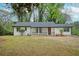 Charming single-story home with a freshly painted exterior, manicured lawn, and inviting front porch at 2190 Highview Rd, Atlanta, GA 30311