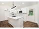 Bright kitchen with white cabinets, modern appliances, an island and wood floors at 2190 Highview Rd, Atlanta, GA 30311