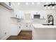 Bright kitchen with white cabinets, modern appliances, an island and wood floors at 2190 Highview Rd, Atlanta, GA 30311