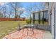 Relaxing backyard featuring a patio seating area and a playset, perfect for outdoor living at 2984 Bayard St, East Point, GA 30344