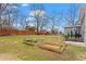 Spacious backyard featuring raised garden beds, a wooden fence, and a play area at 2984 Bayard St, East Point, GA 30344