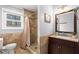 Bathroom boasts tiled floors, shower, and an elegant vanity with a large mirror at 2984 Bayard St, East Point, GA 30344