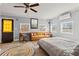 Inviting bedroom featuring a daybed, desk, ceiling fan, and natural light, offering a cozy retreat at 2984 Bayard St, East Point, GA 30344