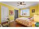 Bright bedroom with hardwood flooring, a desk, and a large window at 2984 Bayard St, East Point, GA 30344