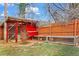 View of the backyard chicken coop in a fenced-in yard with chickens at 2984 Bayard St, East Point, GA 30344