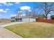 View of home's exterior with attached garage and long driveway at 2984 Bayard St, East Point, GA 30344