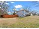 Side exterior view of the home with a fenced-in yard at 2984 Bayard St, East Point, GA 30344
