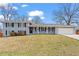 Charming single-story home with blue painted brick and a well-manicured front lawn at 2984 Bayard St, East Point, GA 30344