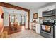Open kitchen with white cabinets, stainless steel appliances, and a view into the adjacent dining area at 2984 Bayard St, East Point, GA 30344