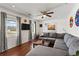 Bright living room with hardwood floors, a comfortable gray sofa, and large windows for natural light at 2984 Bayard St, East Point, GA 30344