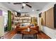Spacious living room with hardwood floors, comfortable seating, and decorative shelving at 2984 Bayard St, East Point, GA 30344