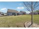 Expansive backyard featuring a covered patio, lush lawn, and well-maintained landscaping at 2815 Paddle Point Ln, Cumming, GA 30041