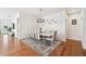 Elegant dining room features stylish decor, including a modern light fixture and seating for six at 2815 Paddle Point Ln, Cumming, GA 30041