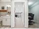 Hallway view of bathroom, bedroom, and office areas, showing a layout of multiple rooms at 2815 Paddle Point Ln, Cumming, GA 30041