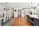 Spacious open-concept kitchen connecting to the dining room with a large island and modern appliances at 2815 Paddle Point Ln, Cumming, GA 30041