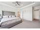 An expansive main bedroom featuring tray ceilings, carpeted floor, with ensuite bathroom access at 2815 Paddle Point Ln, Cumming, GA 30041