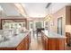 Well-appointed kitchen featuring granite countertops, custom cabinetry, and stainless steel appliances at 90 Belleview Rdg, Sharpsburg, GA 30277