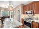 Modern kitchen boasts stainless steel appliances, granite countertops, and ample cabinet space for storage at 90 Belleview Rdg, Sharpsburg, GA 30277