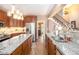 Gourmet kitchen with central island, granite counters, stainless appliances, and eat-in area, perfect for cooking at 90 Belleview Rdg, Sharpsburg, GA 30277